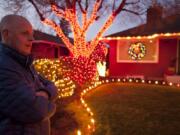 Lincoln Nnighborhood resident Neal Dykeman discusses placing more than 5,000 lights on a single tree.