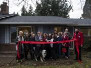 A Warrior&#039;s Way founders, volunteers and friends gather for a ribbon-cutting ceremony at the new transitional 10-person home for veterans in the East Minnehaha neighborhood.