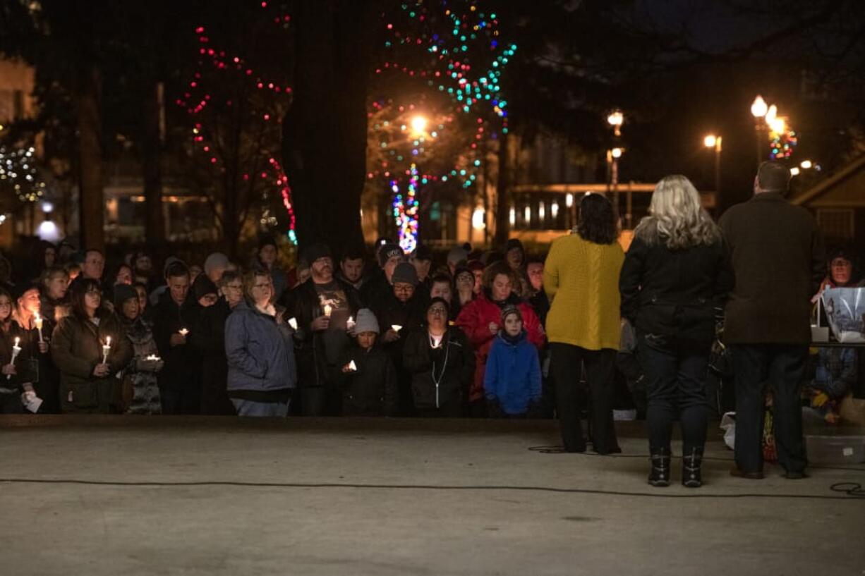 Family members and supporters gather to share stories of Tiffany Hill on Sunday at Esther Short Park in Vancouver.