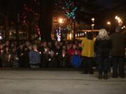 Family members and supporters gather to share stories of Tiffany Hill on Sunday at Esther Short Park in Vancouver.