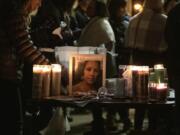 A photo of Tiffany Hill is seen on display at a candlelight vigil Sunday at Esther Short Park in Vancouver.