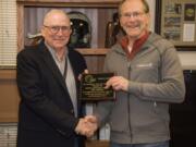 Fairgrounds: Retired Clark County Fair Manager and CEO John Morrison, left, is presented with a Lifetime Achievement Award from the Washington State Fairs Association by Scott Horenstein with the Clark County Fair Association.