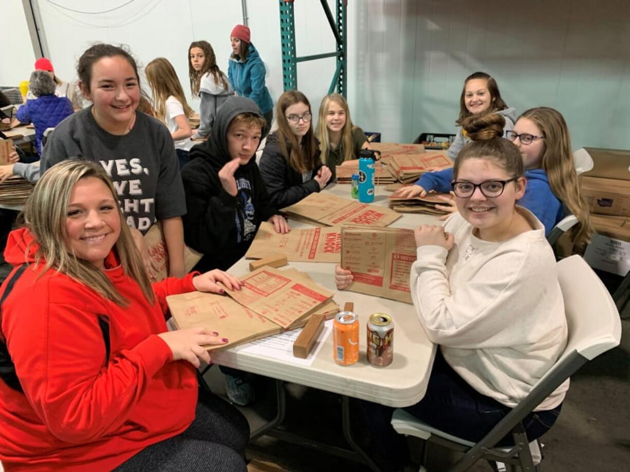 Minnehaha: Volunteers helped fold more than 130,000 bags to be used in today&#039;s Walk &amp; Knock food drive.