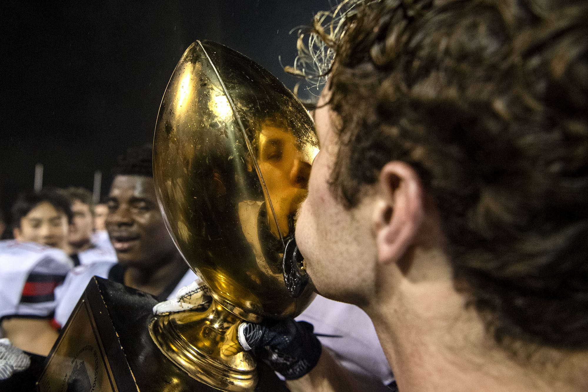 Camas' Charlie Bump (8) kisses the trophy after winning SaturdayÕs Class 4A state championship game against Bothell at Mount Tahoma High School in Tacoma on Dec. 7, 2019.