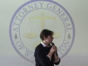 Event organizer Kyle Nelson, 18, introduces a video from state Attorney General Bob Ferguson during the Use Your Voice advocacy training event at Excelsior High School on Thursday.