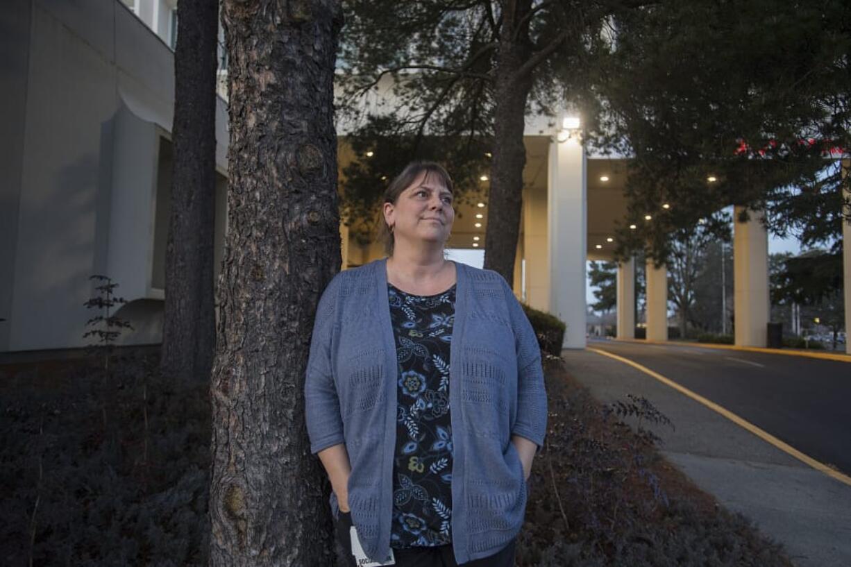 Teresa Kirchner, a leader of a hearing-voices group in Vancouver, stands outside her office on Main Street in Vancouver. The Hearing Voices Network is a guiding organization for more than 180 support groups across the world designed for those who hear voices or have visions that others around them don&#039;t see or hear.