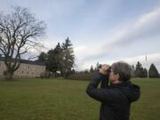 Photographer, artist and birder Pamela Gunn searches for feathered friends in the sky over the Fort Vancouver National Site. Gunn will give a talk about birding at the fort, and her concerns about vanishing bird habitat, Saturday afternoon at the site&#039;s visitor center.