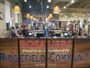 Shoppers check out at the new Ridgefield Rosauers, which opened on Saturday.