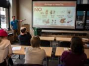 Vancouver Public Works AmeriCorps member Shane Carter discusses items that are not compostable during a lunch-and-learn class offered by Vancouver&#039;s solid waste department at Columbia Bank&#039;s Community Room in Vancouver.