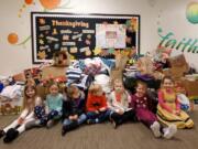 Vancouver Heights: Students at Circle of Friends Preschool with some of the items collected for their needs drive.