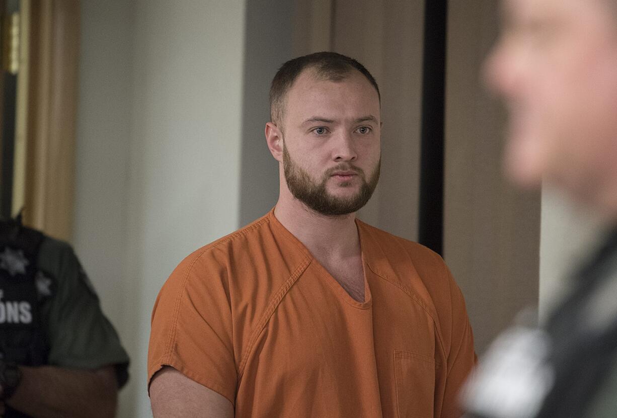 David Y. Bogdanov, center, makes a first appearance in connection with the death of Nikki Kuhnhausen in Clark County Superior Court on Wednesday morning, Dec. 18, 2019.