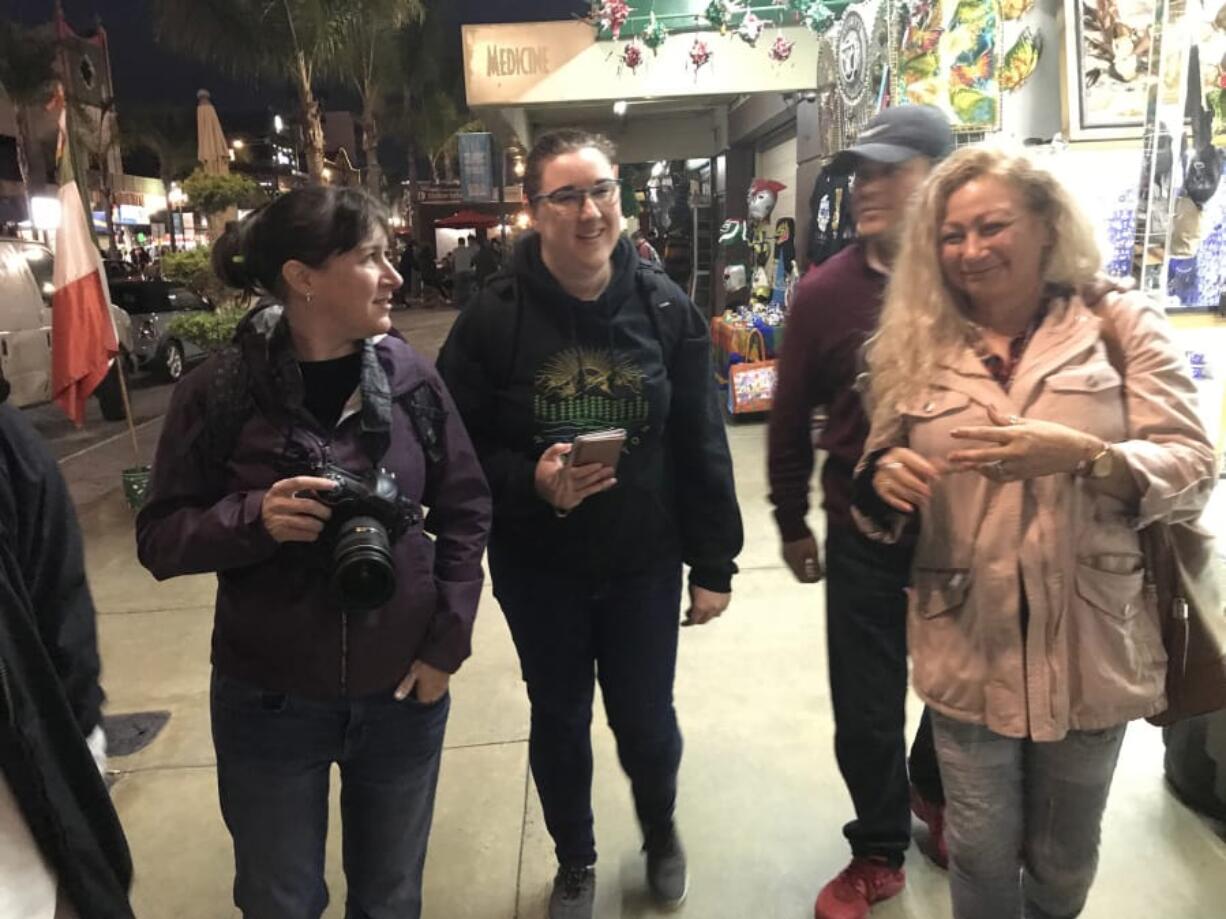 Columbian Photo Editor Amanda Cowan, left, and Assistant Metro Editor Jessica Prokop explore downtown Tijuana, Mexico, in November 2019 with Ramon and Enedis Flores.