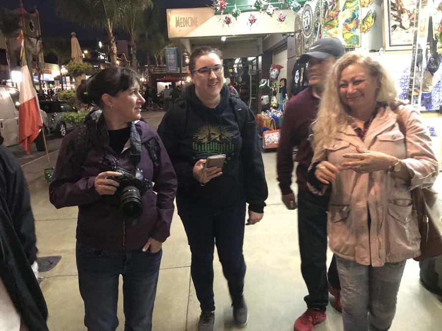 Columbian Photo Editor Amanda Cowan, left, and Assistant Metro Editor Jessica Prokop explore downtown Tijuana, Mexico, in November 2019 with Ramon and Enedis Flores.