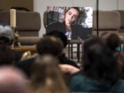 A photo of Nikki Kuhnhausen is placed at the front of the room during a vigil for the 17-year-old on Dec. 20 at Vancouver United Church of Christ in Hazel Dell.