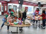 BATTLE GROUND: Students sort items for its Winter Wishes week of giving. Each December, Battle Ground schools host a variety of activities and events that support and engage families and inspire students to focus on community.