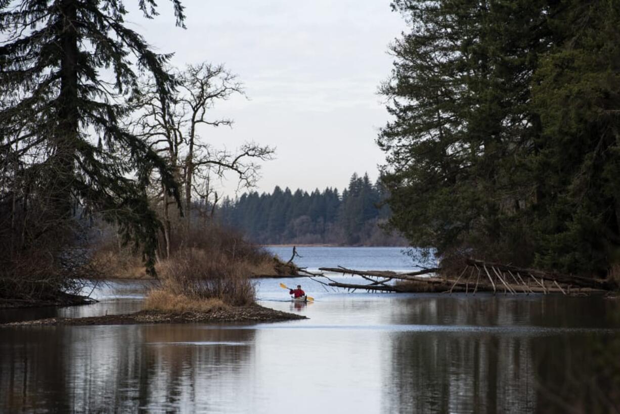 Jerry Ames of Vancouver kayaks on Lacamas Lake in Camas in late 2019. Ames said he wanted to take advantage of the nice weather to get out on the lake before the rain rolls in. The forecast calls for cloudy weather and possible showers over the weekend.