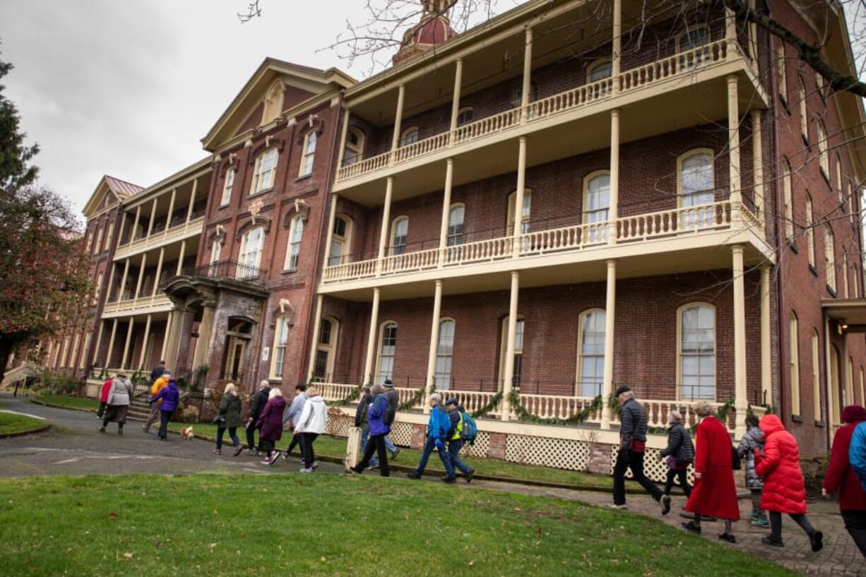 Several dozen people arrive at Providence Academy, completing a 1.6 mile-walk from the Vancouver waterfront on Sunday. The event was hosted by The Historic Trust and retraced the steps of the Sisters of Providence arrival in Vancouver in 1856.