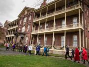 Several dozen people arrive at Providence Academy, completing a 1.6 mile-walk from the Vancouver waterfront on Sunday. The event was hosted by The Historic Trust and retraced the steps of the Sisters of Providence arrival in Vancouver in 1856.