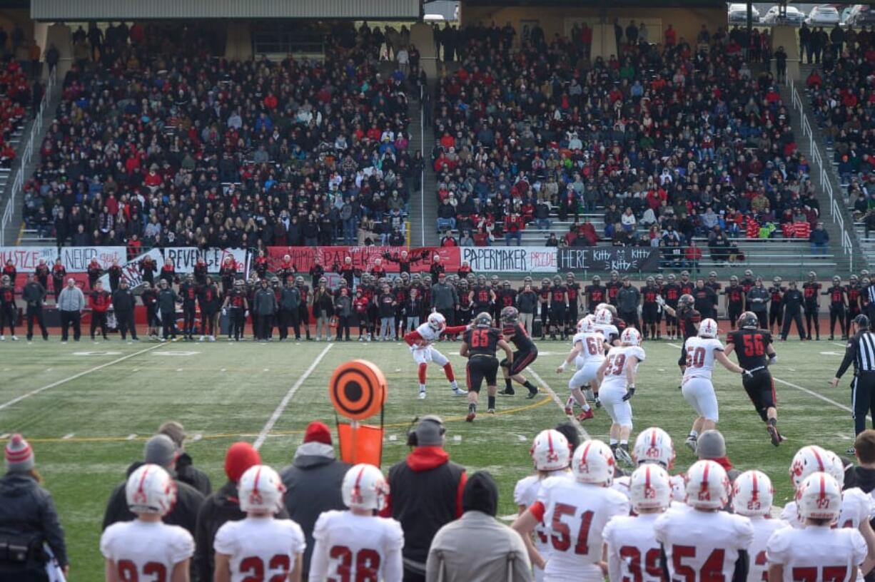 Mount Si quarterback Clay Millen is pressured by the Camas defense at McKenzie Stadium on Saturday afternoon, November 30, 2019. Camas beat Mount Si 35-14 to move on to the 4A state title game.