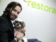 Brian Larsen, holding his buddy Nibber, is the founder and CEO of RestoraPet in Gaithersburg, Md., which makes nutritional supplements for dogs, cats and horses.