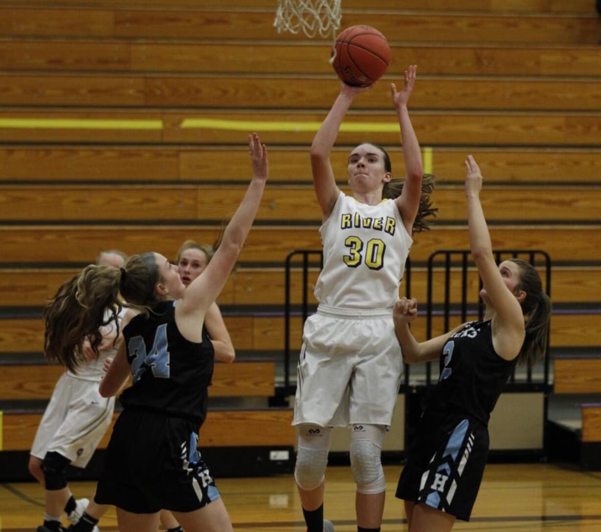 Columbia River&#039;s Jordan Ryan rises for a shot against Hockinson.