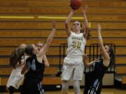 Columbia River&#039;s Jordan Ryan rises for a shot against Hockinson.