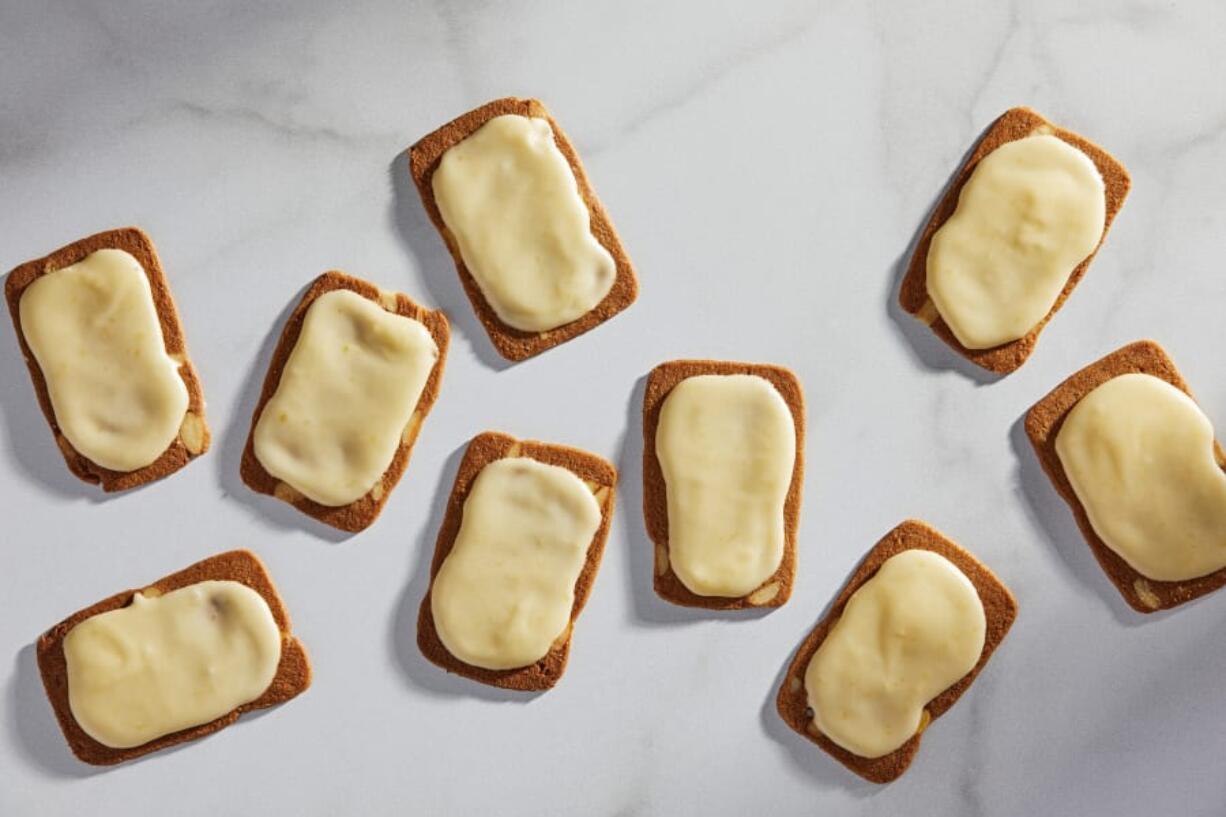 Thin almond cookies spread with a thick mango glaze.