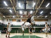 Union&#039;s Josh Reznick competes a layup against Evergreen during a game at Evergreen High School on Wednesday night.