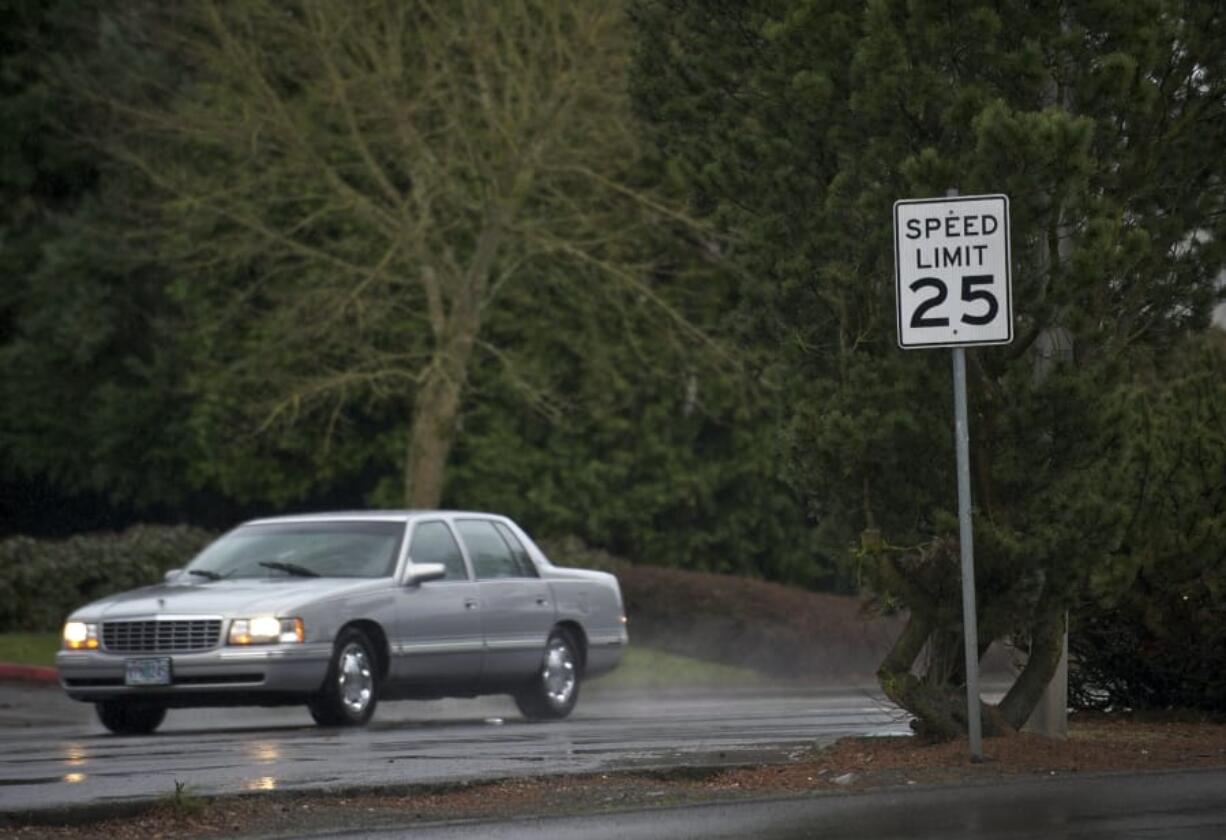 A vehicle travels westbound on McGillivray Boulevard just east of 136th Avenue in 2014. In the summer of 2020 the intersection will see upgrades designed to improve pedestrian safety, including new crosswalk striping and signage as part of Vancouver&#039;s Neighborhood Traffic Calming Program.