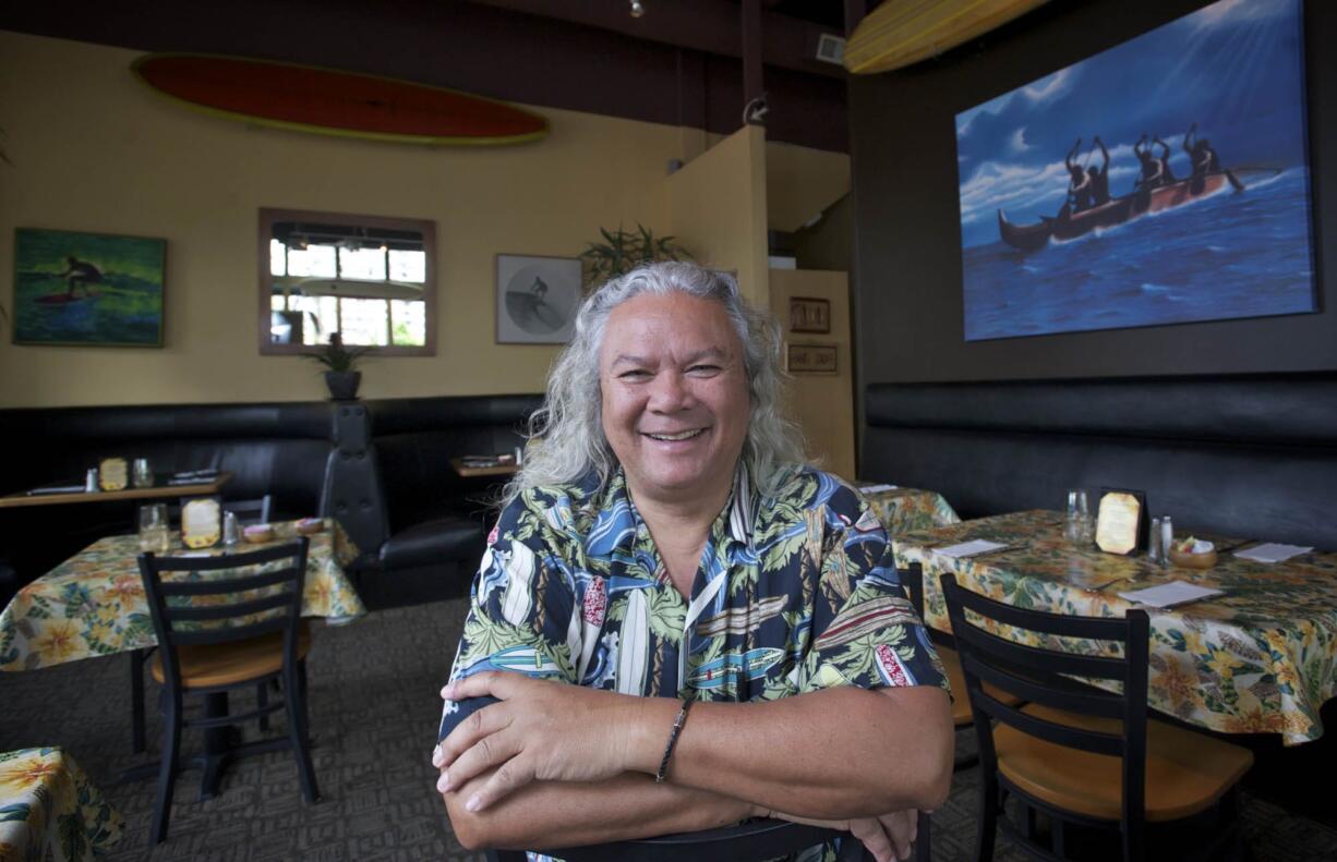 Tommy O's owner Tom Owens poses for a portrait in the dining room of his downtown restaurant in 2012.