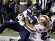 Seattle Seahawks&#039; Marshawn Lynch (24) scores a touchdown on a 1-yard rush against the San Francisco 49ers during the second half of an NFL football game, Sunday, Dec. 29, 2019, in Seattle.