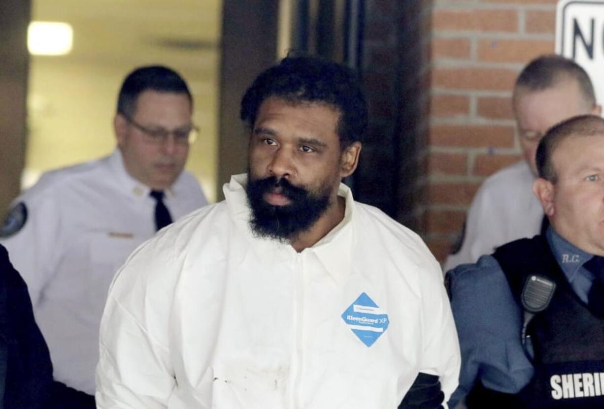 Grafton Thomas is led from Ramapo Town Hall in Ramapo, N.Y. following his arraignment Sunday, Dec. 29, 2019. Thomas was charged in the stabbings of multiple people as they gathered to celebrate Hanukkah at a rabbi&#039;s home in Monsey, an Orthodox Jewish community north of New York City.