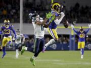 Los Angeles Rams cornerback Troy Hill breaks up a pass intended for Seattle Seahawks wide receiver Tyler Lockett during the first half of an NFL football game Sunday, Dec. 8, 2019, in Los Angeles.