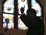 FILE - In this Wednesday, Aug. 28, 2013 file photo, Rev. Shanan Jones delivers a sermon at Ebenezer Baptist Church in Atlanta. According a study released on Monday, Dec. 16, 2019 by the Pew Research Center, the median length of U.S. sermons in April and May was 37 minutes. Catholic sermons were the shortest, at a median of just 14 minutes, compared with 25 minutes for sermons in mainline Protestant congregations and 39 minutes in evangelical Protestant congregations. Historically black Protestant churches had by far the longest sermons, at a median of 54 minutes.