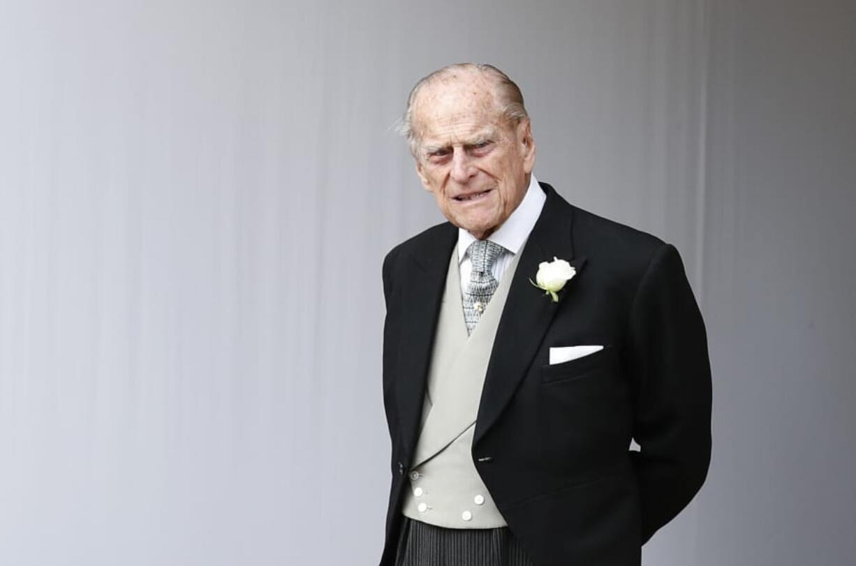 FILE - In this Friday, Oct. 12, 2018 file photo, Britain&#039;s Prince Philip waits for the bridal procession following the wedding of Princess Eugenie of York and Jack Brooksbank in St George&#039;s Chapel, Windsor Castle, near London, England. Buckingham Palace says Prince Philip has been admitted to a London hospital &quot;as a precautionary measure.&quot;  The palace said Friday, Dec. 20, 2019 that the 98-year-old husband of Queen Elizabeth II is in the King Edward VII hospital for observation and treatment of a pre-existing condition.