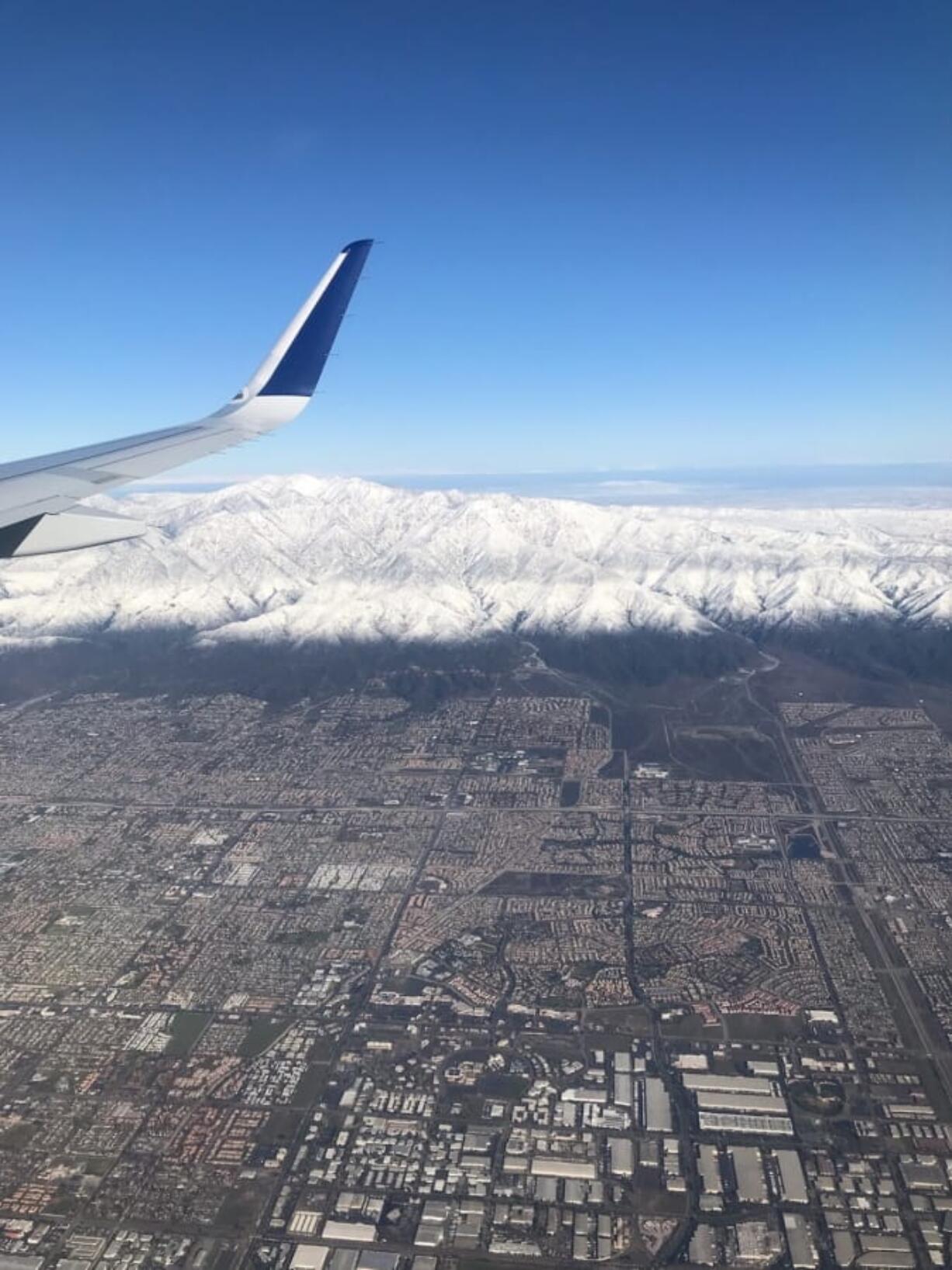 This photo provided by Greg Weber shows a snow covered Mount Baldy in the San Gabriel Mountains, east of Los Angeles on Friday, Dec. 27, 2019. A winter storm has brought a deluge of rain and snow to Southern California. Snow has shut down the vital Interstate 5 in Tejon Pass through the mountains north of Los Angeles and dozens of miles of Interstate 15 from Baker, California, to Primm, Nevada.