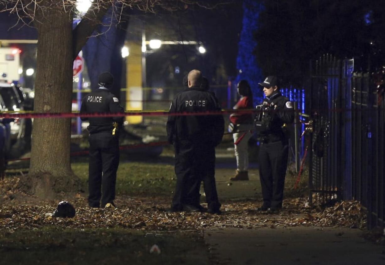 Chicago police guard a crime scene in the 5700 block of S. May Street in Chicago after several people were shot there on Sunday, Dec. 22, 2019.