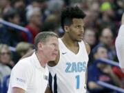 Gonzaga head coach Mark Few, left, speaks with guard Admon Gilder (1) during the second half of an NCAA college basketball game against Eastern Washington in Spokane, Wash., Saturday, Dec. 21, 2019. Gonzaga won 112-77.