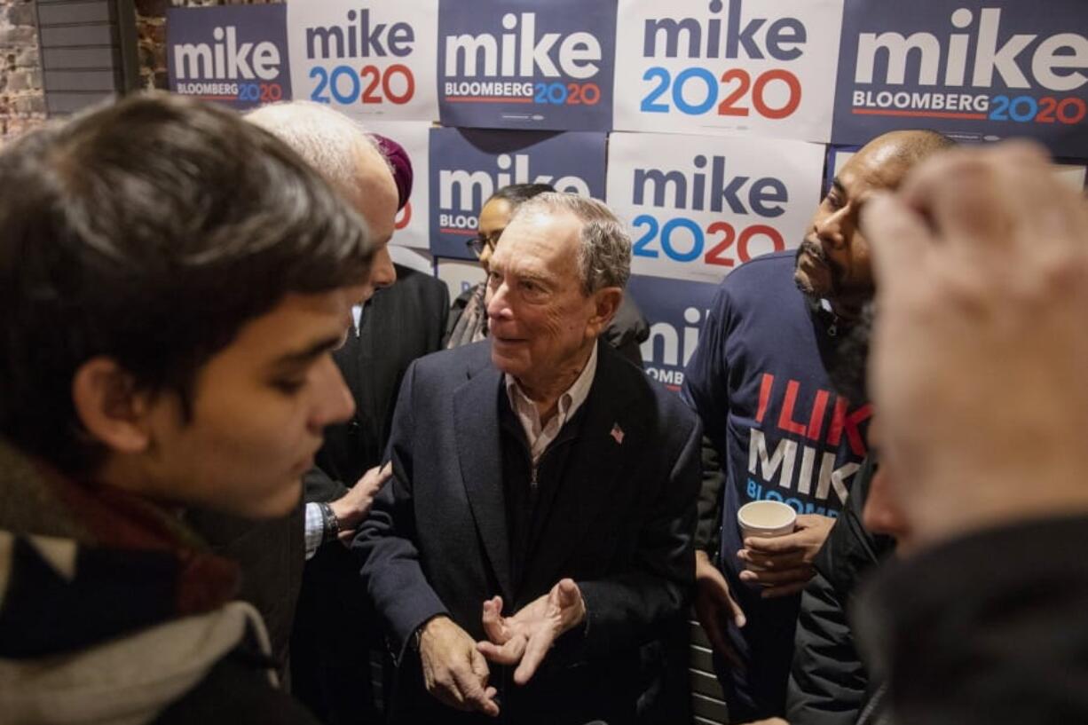 Democratic presidential candidate Michael Bloomberg walks into the crowd of supporters and volunteers to speak to them and take photos after speaking in Philadelphia on Saturday, Dec. 21, 2019.