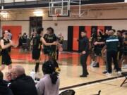 Evergreen's Jaden Stanley yells to the crowd after the Plainsmen's 59-51 win over Battle Ground on Monday.