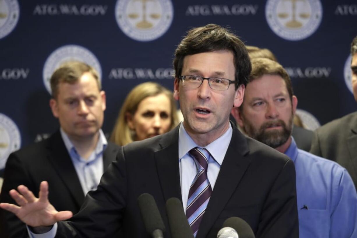 Washington state Attorney General Bob Ferguson speaks at a news conference announcing legislation to combat mass shootings in the state, Thursday, Dec. 12, 2019, in Seattle. Gov. Jay Inslee is joining Ferguson to propose limits to magazine capacity and a ban on the sale of assault weapons.