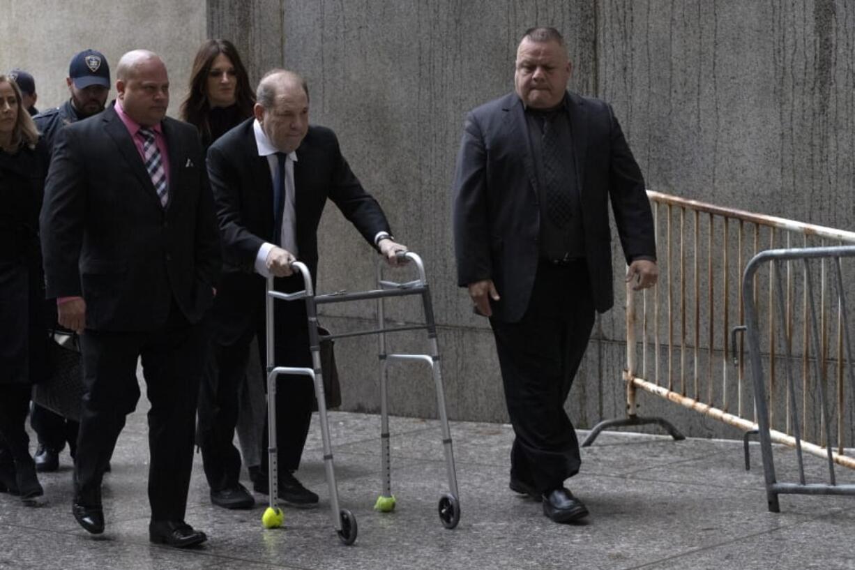 Harvey Weinstein, center, arrives for a court hearing, Wednesday, Dec. 11, 2019 in New York.