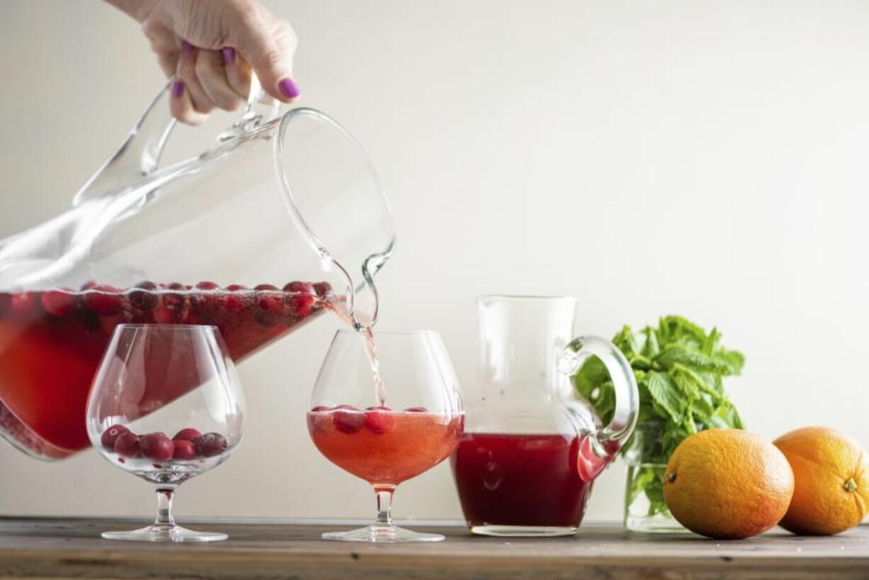 In this July 2019 photo, leftover champagne was poured to add a bit of sparkle to this Cranberry Orange Shrub in New York.