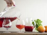 In this July 2019 photo, leftover champagne was poured to add a bit of sparkle to this Cranberry Orange Shrub in New York.