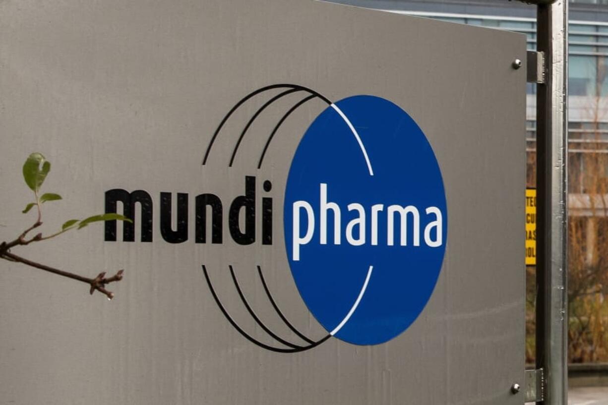 This Dec. 12, 2019, photo shows a sign at the Mundipharma International headquarters at Cambridge Science Park in England. Mundipharma is the international affiliate of Purdue Pharma, the maker of the blockbuster painkiller OxyContin. Mundipharma is now marketing Nyxoid, a new brand of naloxone, an opioid overdose reversal medication.