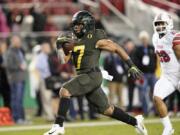 Oregon running back CJ Verdell (7) rushes for a touchdown past Utah defensive back Javelin Guidry (28) during the second half of an NCAA college football game for the Pac-12 Conference championship in Santa Clara, Calif., Friday, Dec. 6, 2018. Oregon won 37-15.