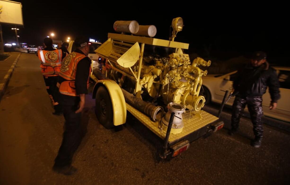 Rescue vehicles, part of a convoy of around 20, arrives in Gaza City, Tuesday, Dec. 17, 2019. Palestinian officials say Israel has allowed the import of around 20 rescue and firefighting vehicles. The equipment was donated by Qatar.