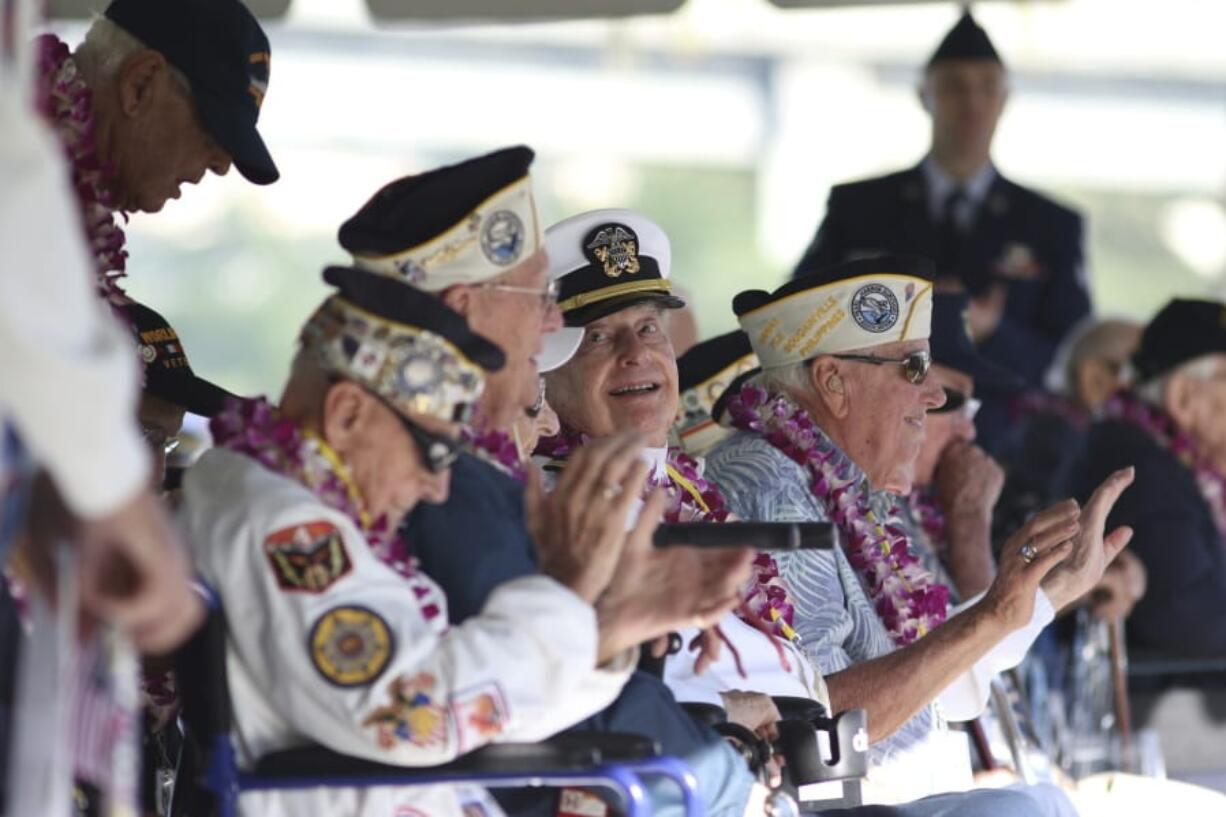 Pearl Harbor survivor Lou Conter, 98, center, who was the only survivor from the USS Arizona to make it to this year&#039;s ceremony, smiles Saturday during the 78th anniversary of the Japanese attack on Pearl Harbor at Pearl Harbor, Hawaii.