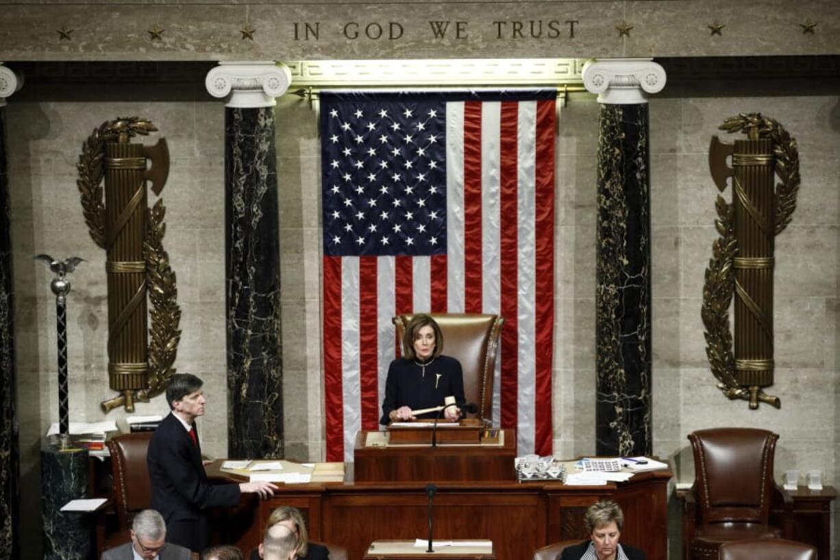 House Speaker Nancy Pelosi, D-Calif., holds the gavel as House members vote on article II of impeachment against President Donald Trump on Dec. 18 on Capitol Hill.