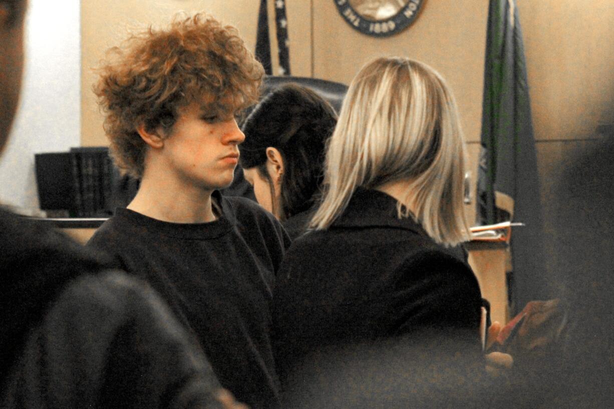 Alexander J. Rivers,17, left, appears in Clark County Superior Court on Friday, Dec. 20, for a first appearance hearing on suspicion of second-degree attempted murder and first-degree robbery.